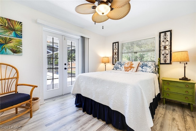 bedroom with access to exterior, light hardwood / wood-style flooring, multiple windows, and ceiling fan