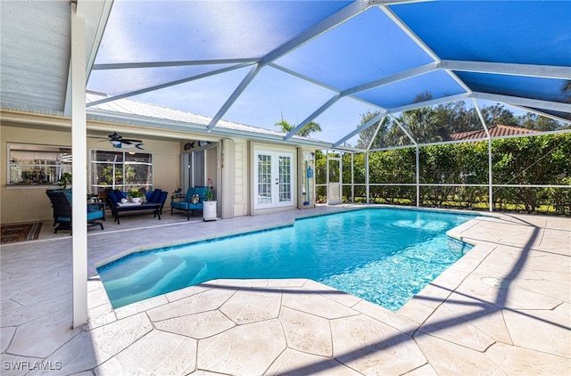 view of pool featuring french doors, a patio, glass enclosure, and ceiling fan