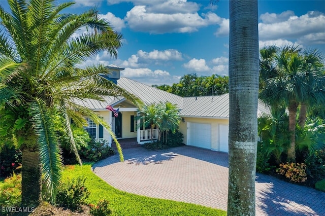 view of front facade with a porch and a garage