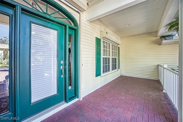 view of exterior entry featuring a porch