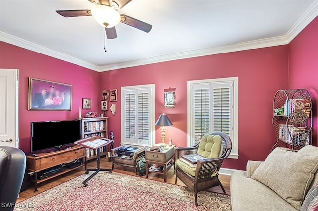 living room featuring ceiling fan, wood-type flooring, and ornamental molding