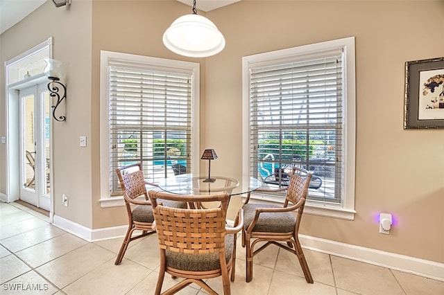 tiled dining area featuring a wealth of natural light