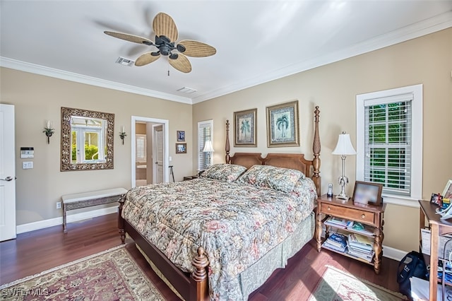 bedroom with ceiling fan, dark hardwood / wood-style floors, and ornamental molding