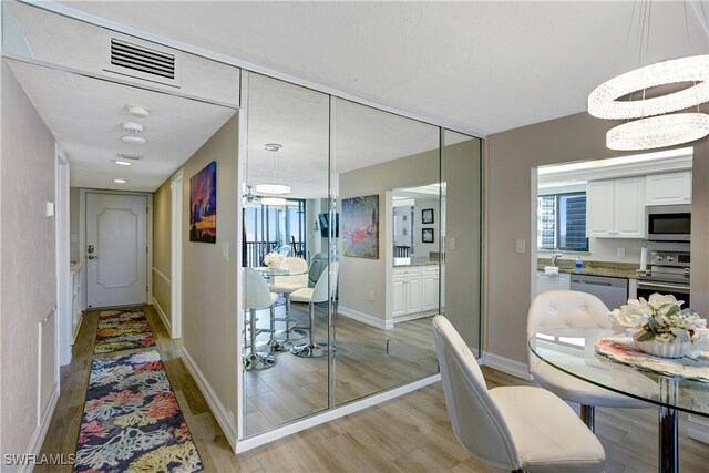 dining room with light hardwood / wood-style flooring