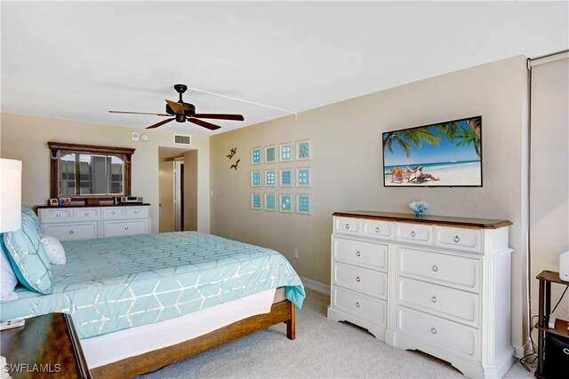 bedroom with ceiling fan and light colored carpet