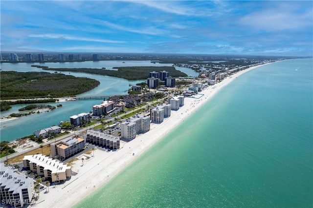 drone / aerial view with a beach view and a water view