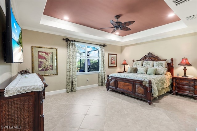 bedroom featuring a tray ceiling, ceiling fan, crown molding, and light tile patterned floors