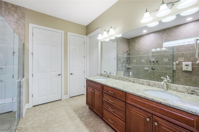 bathroom with vanity, tile patterned floors, and an enclosed shower