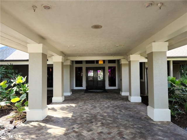 entrance to property featuring french doors