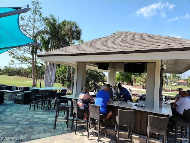 view of patio / terrace with a gazebo and exterior bar