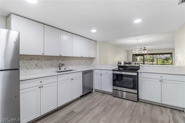 kitchen with sink, white cabinetry, and stainless steel appliances