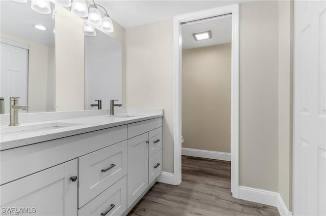 bathroom featuring vanity and wood-type flooring