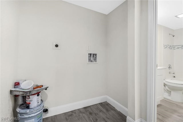 washroom with washer hookup, wood-type flooring, and electric dryer hookup