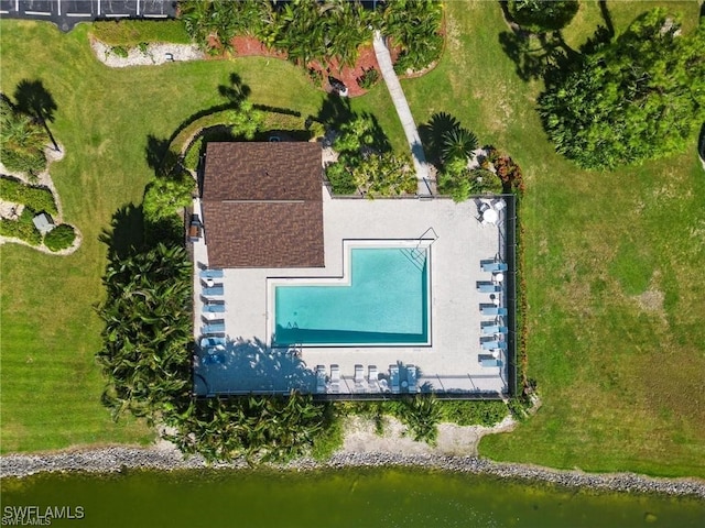 birds eye view of property with a water view