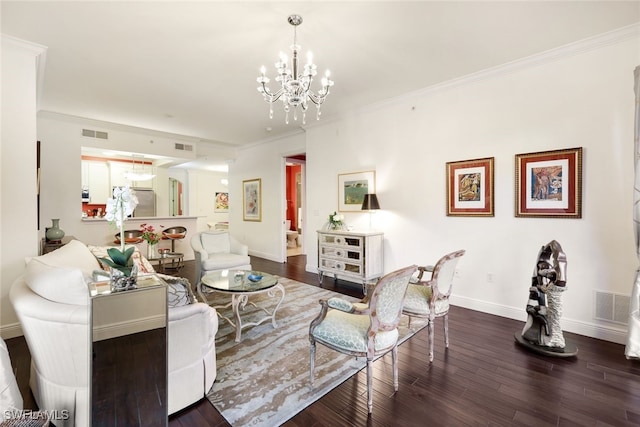 living room with an inviting chandelier, crown molding, and dark wood-type flooring