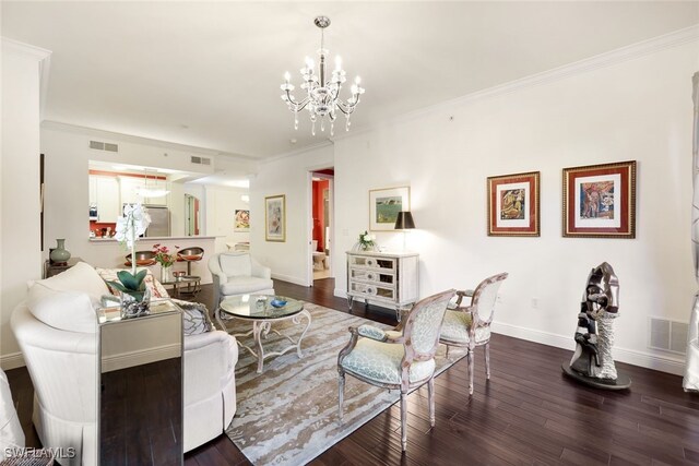 living room featuring ornamental molding, dark wood-type flooring, and an inviting chandelier