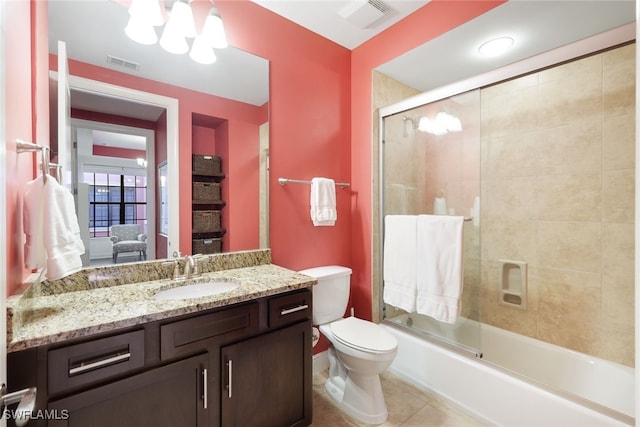 full bathroom with toilet, shower / bath combination with glass door, a chandelier, vanity, and tile patterned flooring