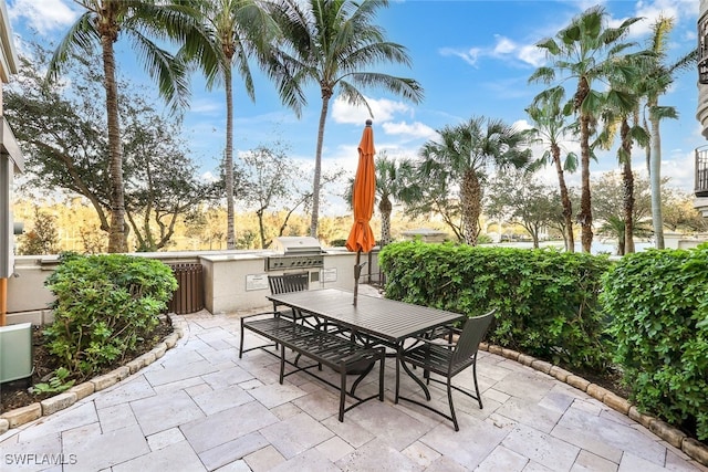 view of patio featuring exterior kitchen and grilling area