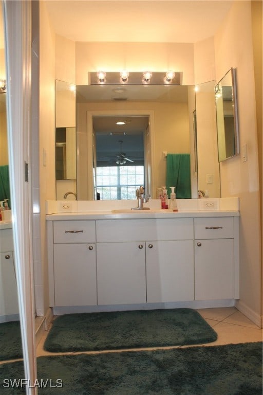 bathroom featuring tile patterned flooring, ceiling fan, and vanity