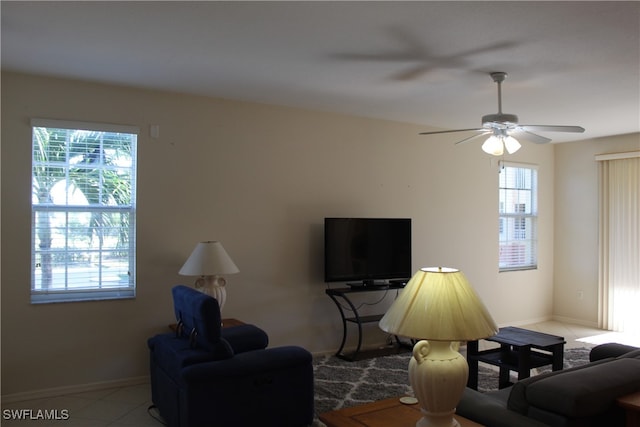 tiled living room featuring ceiling fan