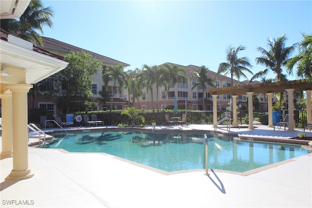 view of swimming pool featuring a pergola and a patio