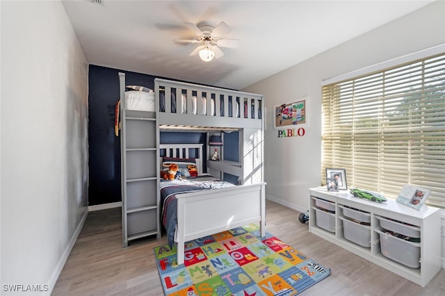 bedroom featuring ceiling fan and wood-type flooring