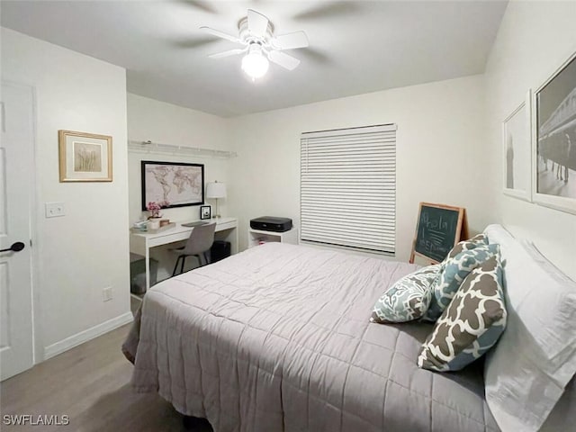 bedroom with light wood-type flooring and ceiling fan