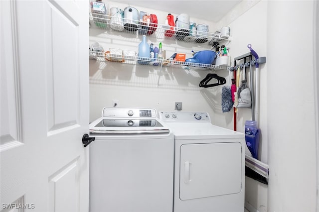 clothes washing area with independent washer and dryer