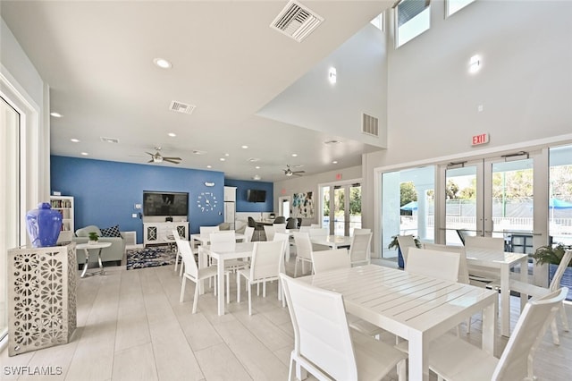 dining room with ceiling fan, french doors, and a healthy amount of sunlight