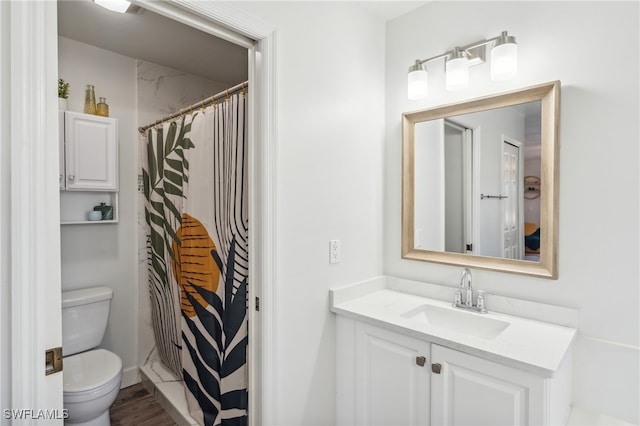 bathroom featuring vanity, a shower with curtain, and toilet