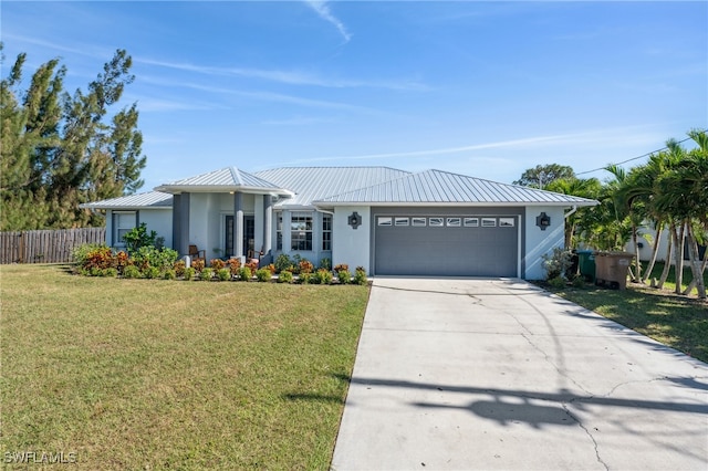 ranch-style home with a garage and a front lawn