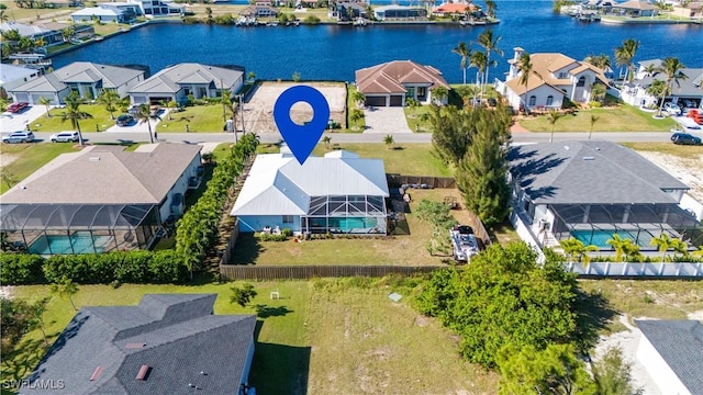 bird's eye view featuring a residential view and a water view