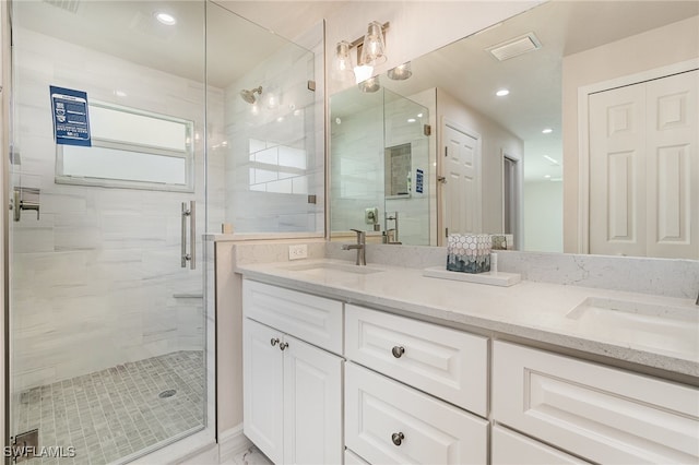 bathroom with vanity and an enclosed shower