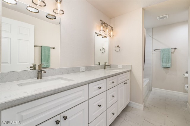 full bathroom with vanity, toilet, and shower / washtub combination