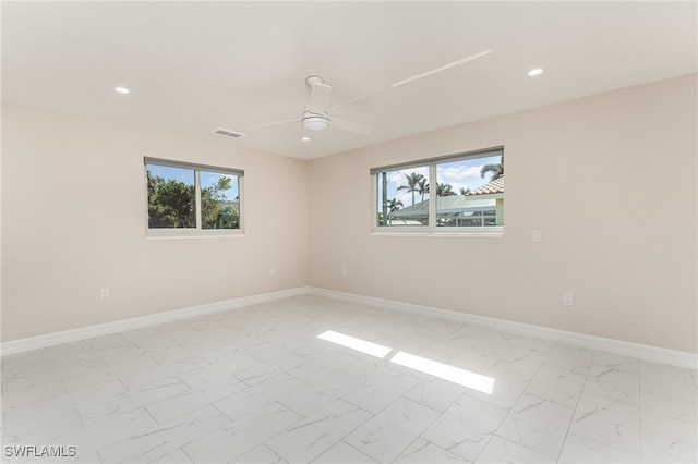 spare room featuring ceiling fan