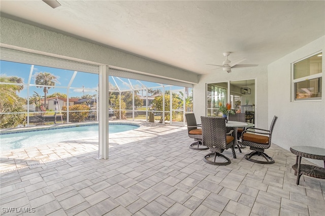 view of pool with ceiling fan