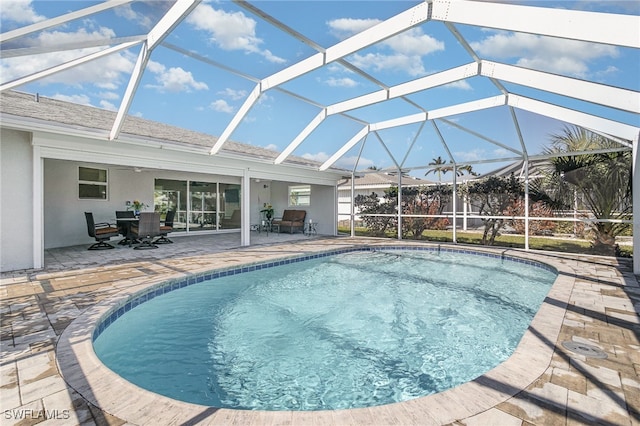 view of pool featuring a lanai and a patio