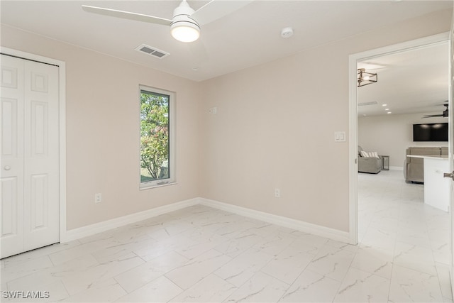 empty room featuring ceiling fan