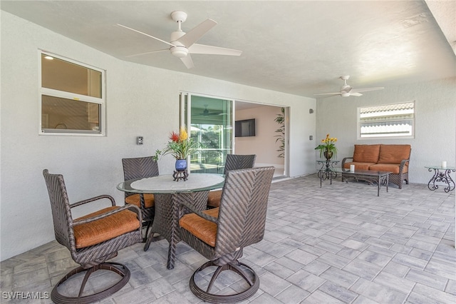 view of patio / terrace with ceiling fan and an outdoor hangout area