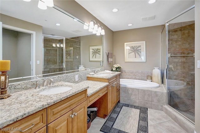 bathroom featuring vanity, tile patterned floors, and separate shower and tub