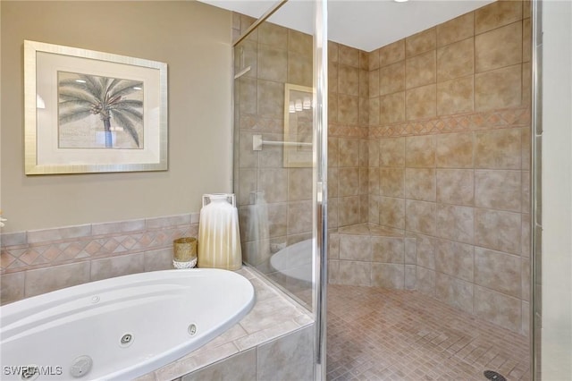 bathroom featuring separate shower and tub