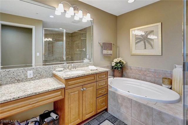 bathroom featuring vanity and plus walk in shower