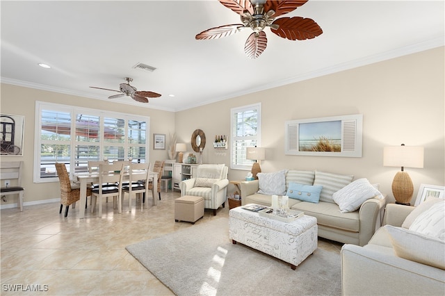 tiled living room with plenty of natural light, crown molding, and ceiling fan