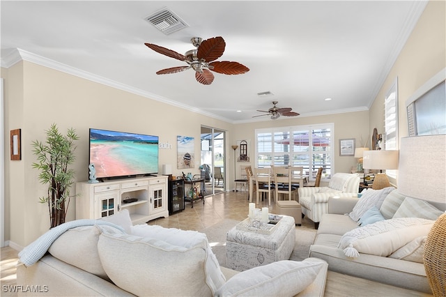 living room with ceiling fan and crown molding