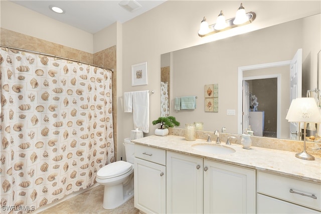 bathroom featuring tile patterned flooring, a shower with curtain, vanity, and toilet