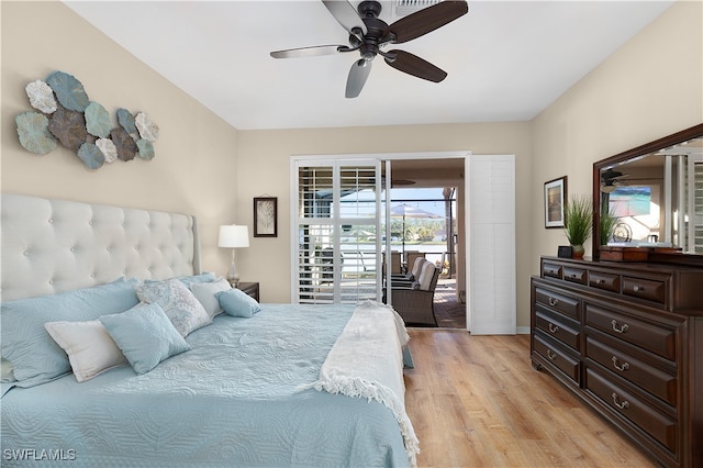 bedroom featuring ceiling fan, access to exterior, and light hardwood / wood-style flooring