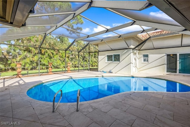 view of pool featuring a patio area and a lanai