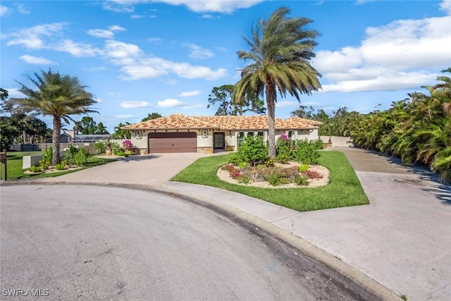 mediterranean / spanish-style home featuring a garage