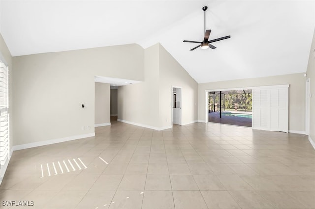 unfurnished living room with high vaulted ceiling, ceiling fan, and light tile patterned flooring