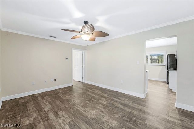 unfurnished room featuring ceiling fan, ornamental molding, and dark wood-type flooring